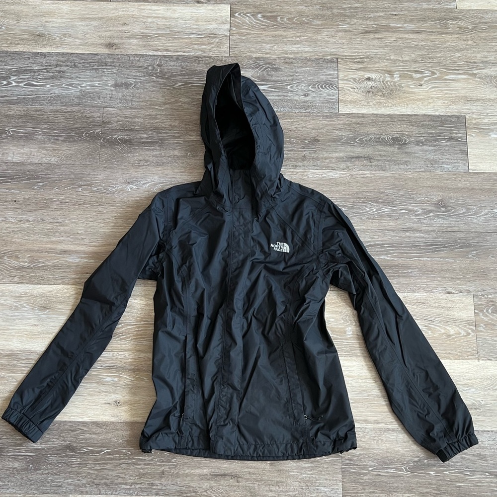 Black North Face windbreaker and rain jacket